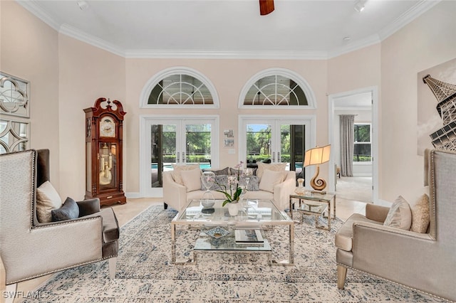 living room with crown molding, french doors, a towering ceiling, and ceiling fan