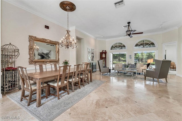 dining room featuring ceiling fan with notable chandelier and crown molding