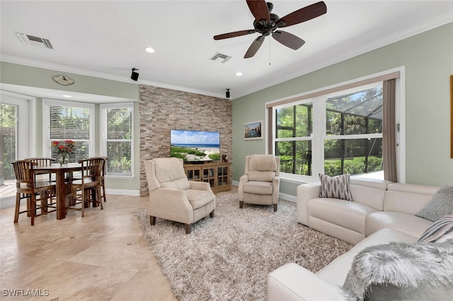 living room with ceiling fan and crown molding