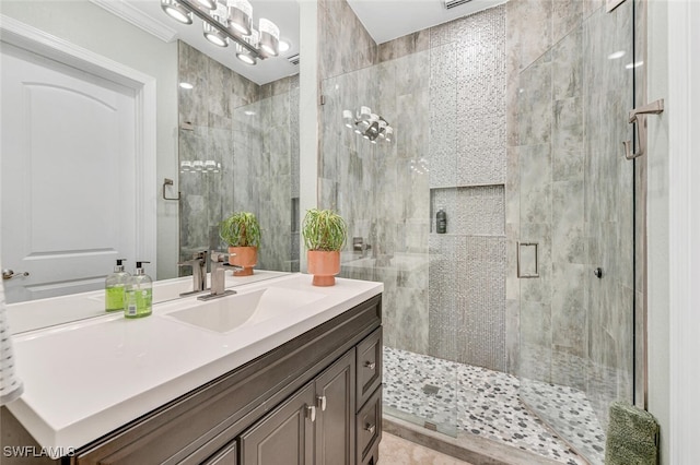 bathroom featuring vanity and an enclosed shower