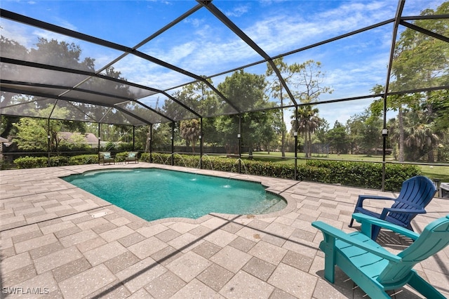 view of swimming pool featuring a lanai and a patio area