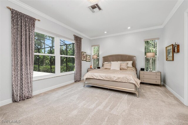 carpeted bedroom featuring crown molding