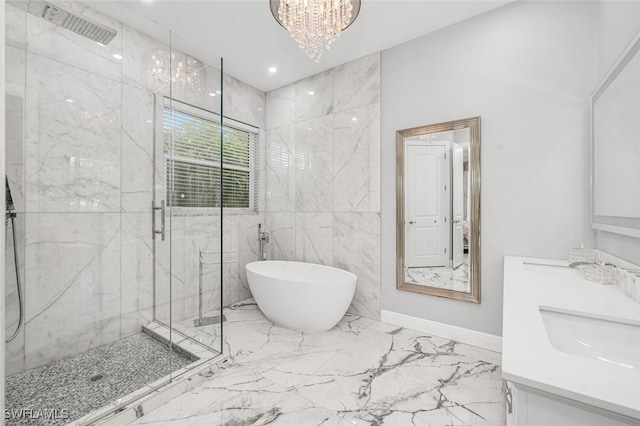 bathroom with vanity, independent shower and bath, and an inviting chandelier