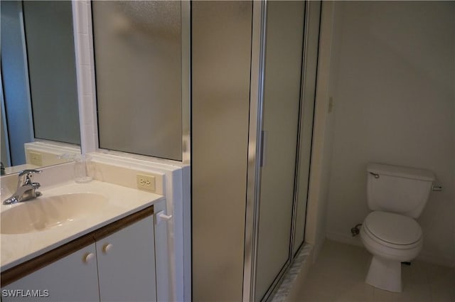 full bathroom with toilet, a stall shower, tile patterned flooring, and vanity