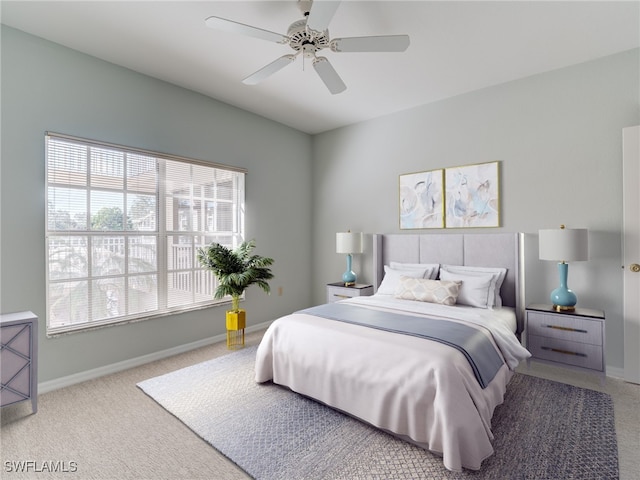 bedroom with carpet floors, baseboards, and a ceiling fan