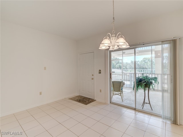 interior space featuring an inviting chandelier and baseboards