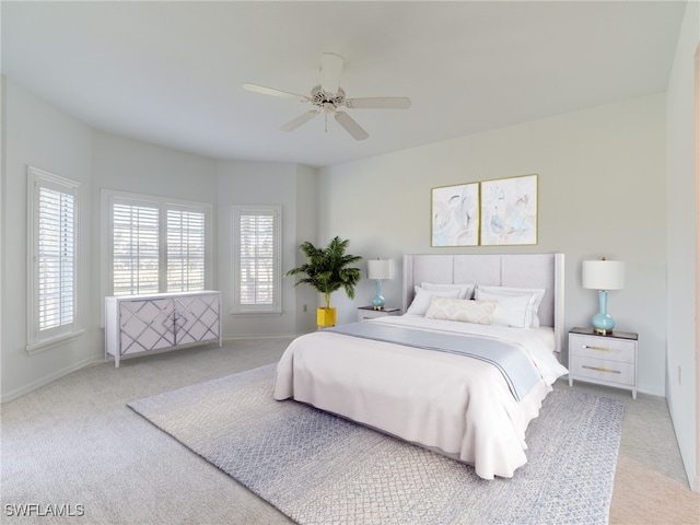 bedroom featuring carpet floors, baseboards, and a ceiling fan