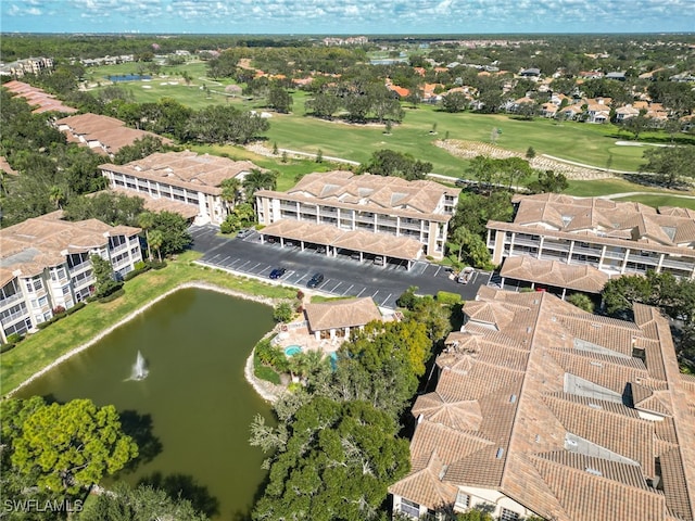 bird's eye view with a residential view, view of golf course, and a water view