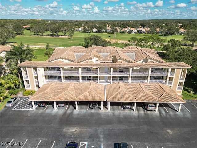 birds eye view of property featuring golf course view