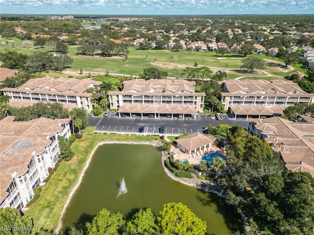 aerial view featuring a water view and golf course view