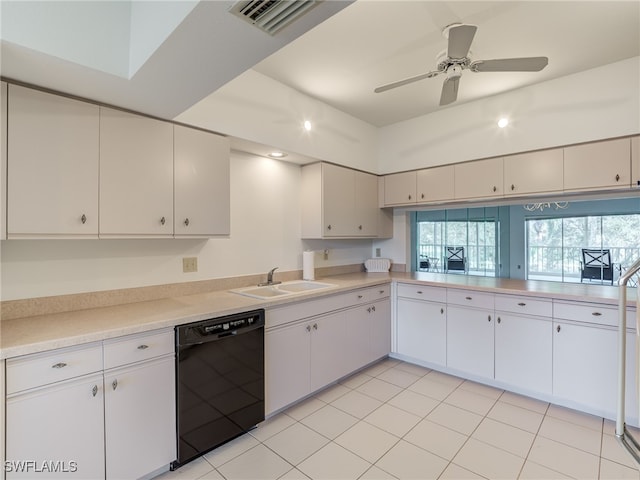 kitchen featuring visible vents, dishwasher, light countertops, white cabinetry, and a sink