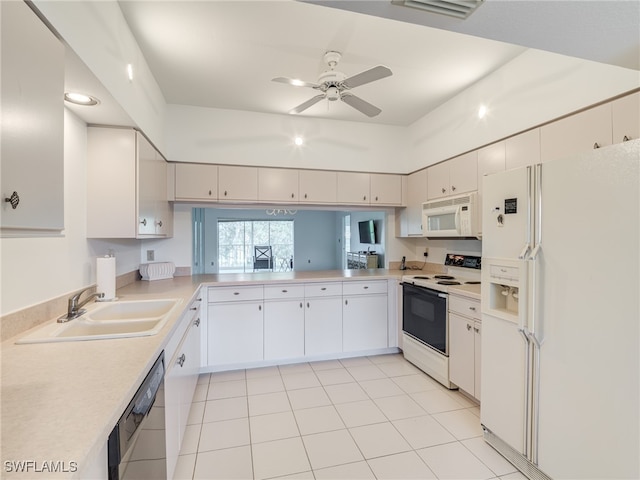 kitchen featuring light countertops, white cabinets, ceiling fan, a sink, and white appliances