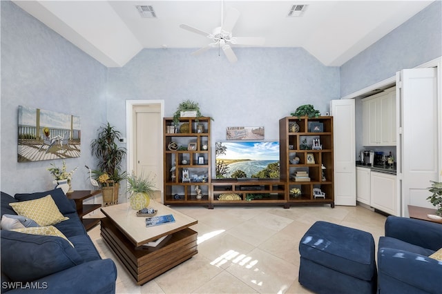 living room with high vaulted ceiling, ceiling fan, and light tile patterned floors