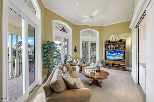 sunroom featuring ceiling fan, wood ceiling, and french doors