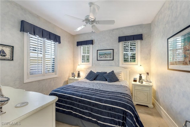 tiled bedroom with ceiling fan