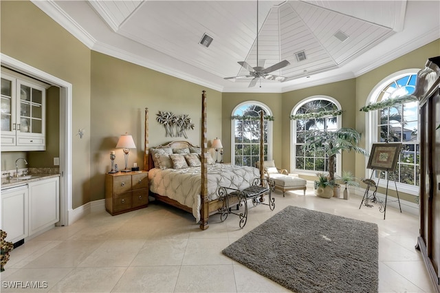 bedroom featuring ceiling fan, ornamental molding, and multiple windows