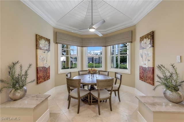 dining room with ceiling fan and crown molding