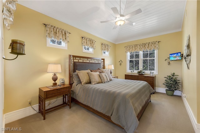 bedroom with light carpet, ceiling fan, wooden ceiling, and multiple windows