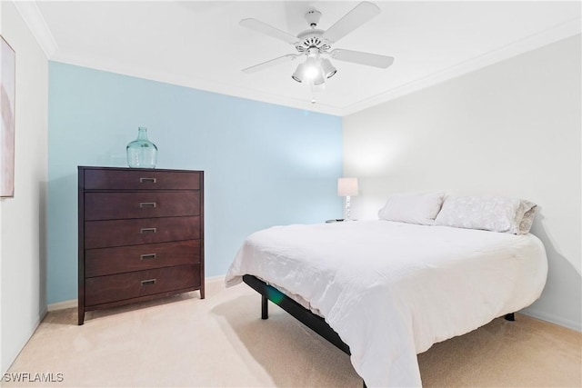 bedroom with light carpet, ceiling fan, and crown molding