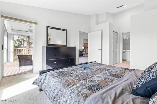 carpeted bedroom featuring connected bathroom and a closet