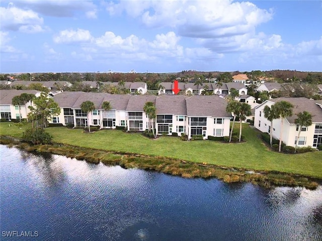 birds eye view of property with a water view