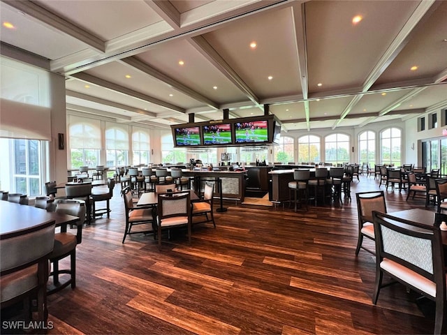 dining area with plenty of natural light, beam ceiling, and coffered ceiling