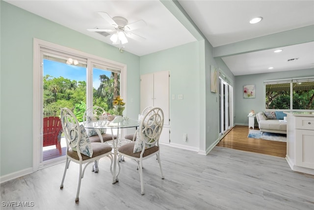 dining space featuring light hardwood / wood-style floors and ceiling fan