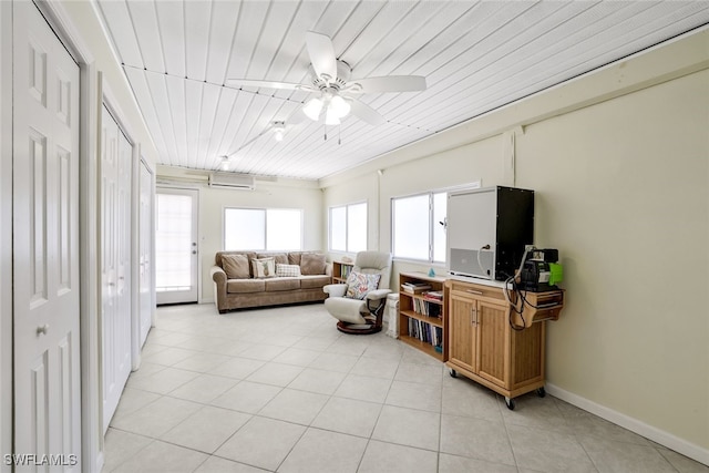 sunroom featuring a wall mounted air conditioner, ceiling fan, wooden ceiling, and track lighting