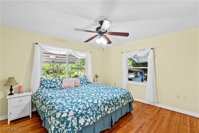 bedroom featuring hardwood / wood-style flooring and ceiling fan