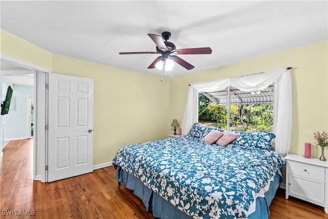 bedroom featuring ceiling fan and wood-type flooring