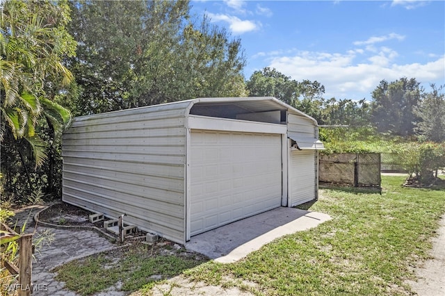 garage with a lawn