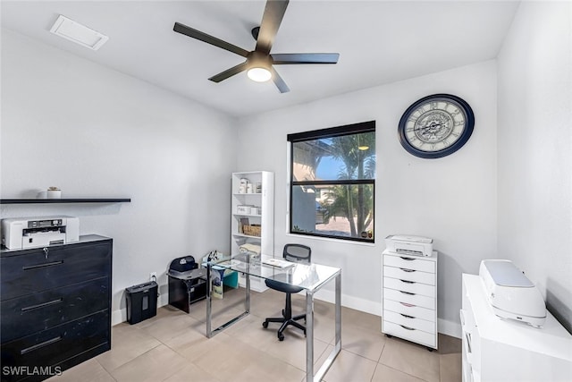 tiled office featuring ceiling fan