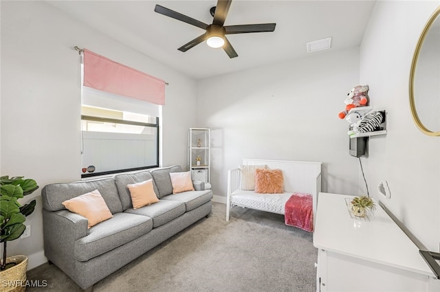 carpeted living room featuring ceiling fan