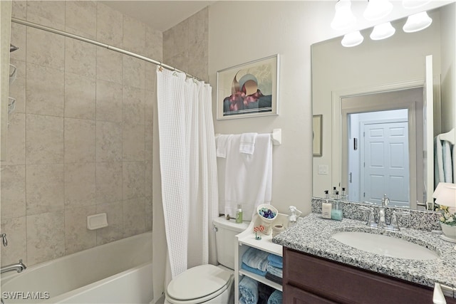 full bathroom featuring vanity, shower / tub combo, and toilet