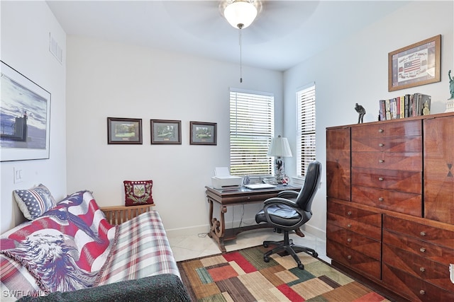 office area featuring ceiling fan and light tile patterned floors