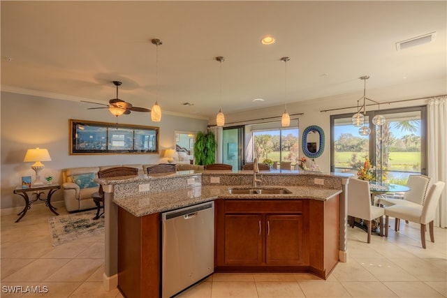 kitchen with dishwasher, sink, plenty of natural light, and an island with sink