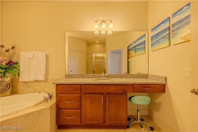 bathroom with tile patterned flooring, vanity, and independent shower and bath