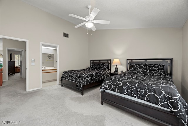 bedroom with connected bathroom, high vaulted ceiling, carpet flooring, and ceiling fan