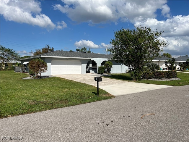 single story home with a front yard and a garage