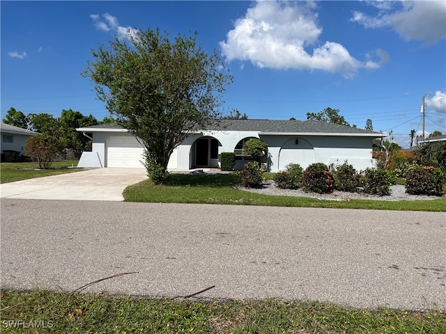 ranch-style house featuring a garage