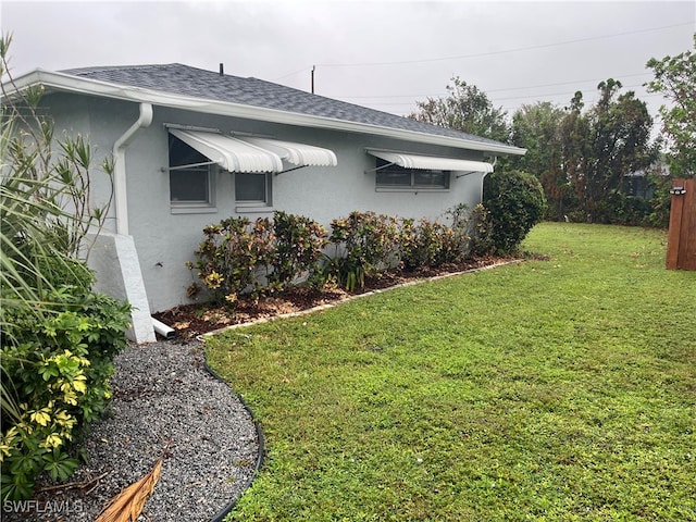 view of property exterior featuring a yard