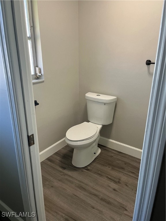 bathroom featuring toilet and hardwood / wood-style flooring