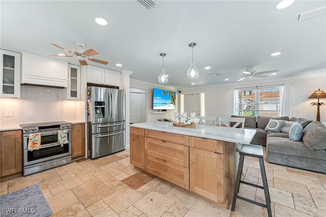 kitchen with ornamental molding, a breakfast bar, stainless steel appliances, decorative light fixtures, and white cabinetry