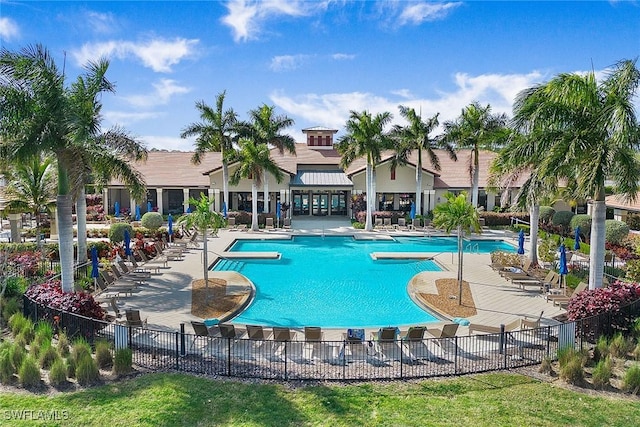 pool featuring a patio area and fence