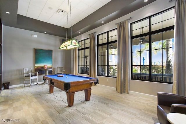 playroom featuring a tray ceiling, pool table, visible vents, and baseboards