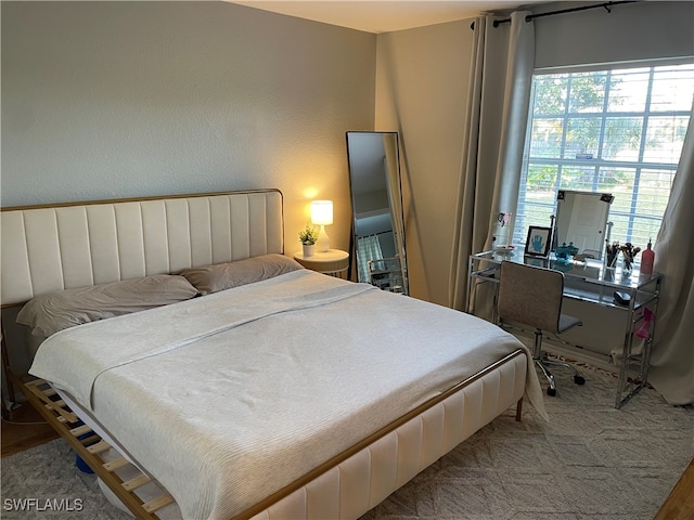 bedroom with wood-type flooring