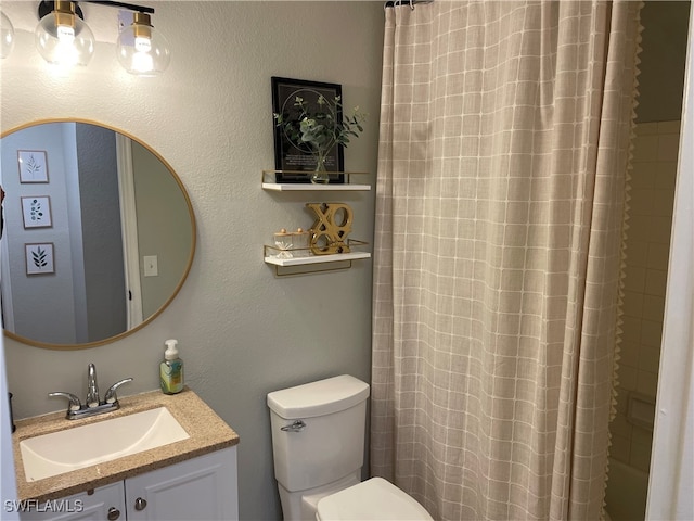 bathroom with vanity, toilet, and a shower with curtain