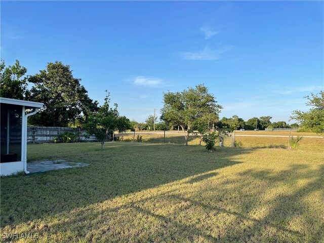 view of yard with a rural view