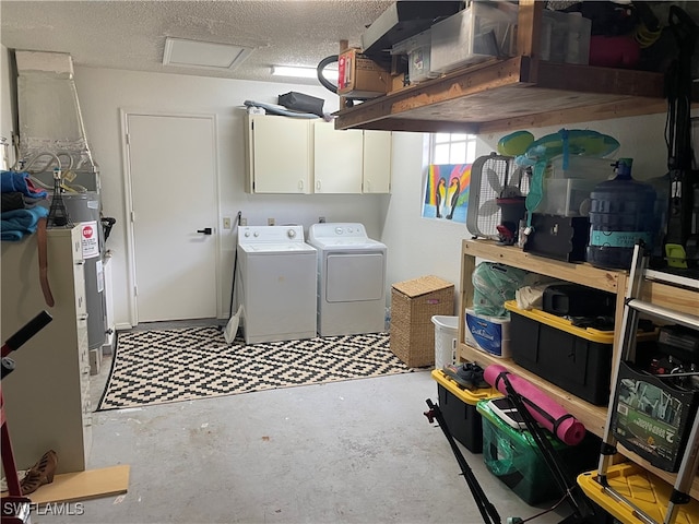 interior space with washer and clothes dryer and a textured ceiling