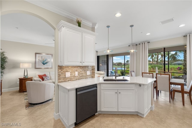 kitchen featuring white cabinets, pendant lighting, stainless steel dishwasher, and sink